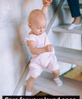 Baby on stairs with adult hand, illustrating Pre Cut 32x4 Non Slip Stair Tape Bundle Fifteen Clear Anti Slip Indoor Outdoor Stair Strips For Extra Home Safety And Traction For Elders Kids And Pets In High Traffic Areas.