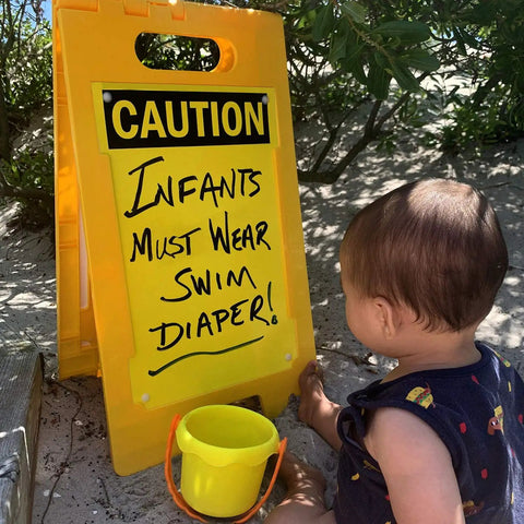 Blank Caution Folding Floor Sign 25 By 12 Inches Double Sided Dry Erase Plastic Sign With Built In Handle Write On Surface Grab And Go Portable Durable Great For Temporary Hazards And Safety Messages. yellow caution floor sign with infant swim diaper message