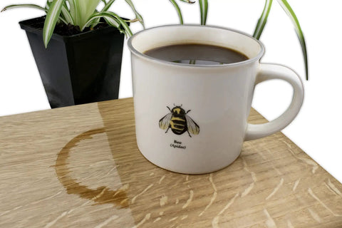 Top Notch Food Safe Hard Wax Oil For Kitchen Countertops And Interior Woodwork Solvent Free Water Repellent Wood Finish Sealant Ridiculously Durable Surface Guard on wooden table beside coffee mug.