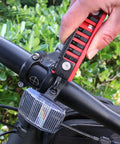 Using 7 In 1 Bike Multitool With Hex Wrenches And Screwdrivers, Ruler, on a bicycle handlebar for on-the-go maintenance