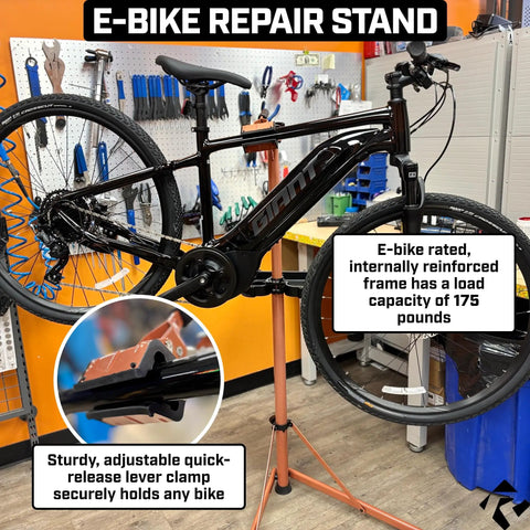 Heavy Duty E Bike Repair Stand With Telescoping Arm 360 Degree Rotating Clamp displayed with a bike in a workshop.