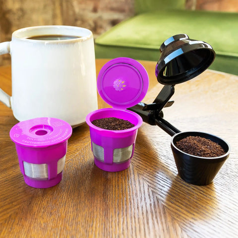 Cafe Fill Value Pack With Reusable K Cup Filters And Scoop For Keurig Brewers on table with coffee cup
