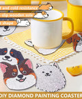 Dog Shaped Diamond Painting Coasters Kit With Holder For Drinks 8 Pieces DIY Diamond Art Coasters For Beginners And Adults Includes Diamonds Glue Pens Trays And Holder A Fun Craft Gift For Craft Lovers, colorful dog-shaped coasters displayed with a mug on a table.