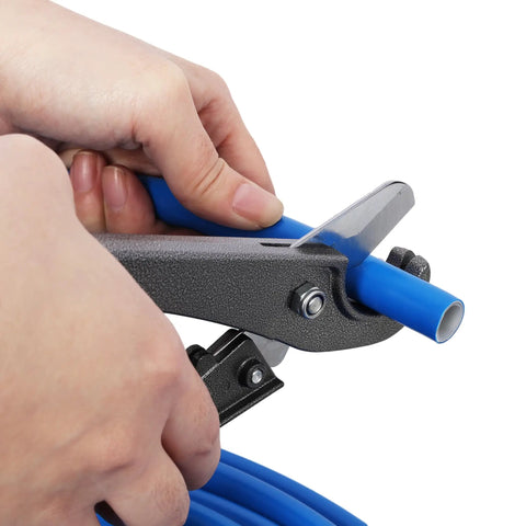 Hands using a cutter on Heavy Duty 1/2 Inch Blue Air Compressor Piping Tube for precise fitting adjustments.