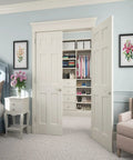 Bedroom with open double doors revealing closet, featuring right hand satin nickel accent door lever non turning dummy handle surface mounted decorative door pull for inactive door or double door setup perfect for home renovations and modern interiors.