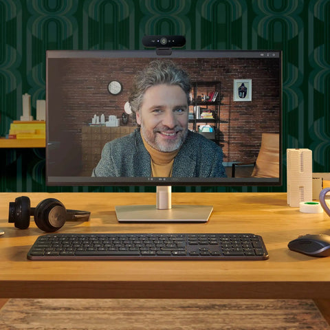 Pro Level 4K Ultra HD Webcam Featuring Swift Auto Focus And Snappy 5X Digital Zoom For Crystal Clear Streams in a home office setup.