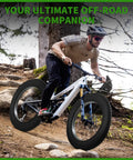 Cyclist riding a bike with 20x4 Fat Tire for Electric Bikes and All Terrain Rides with Puncture Resistant Sidewalls on a forest trail.