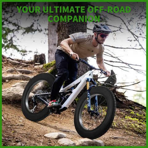 Cyclist riding a bike with 20x4 Fat Tire for Electric Bikes and All Terrain Rides with Puncture Resistant Sidewalls on a forest trail.