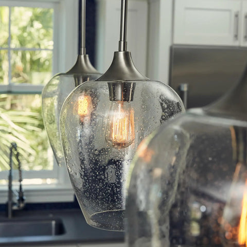 One Light Brushed Nickel Mini Pendant With Clear Seeded Glass Shade Sloped Ceiling Compatible Hanging Light in kitchen