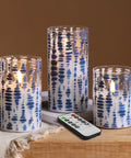 Blue Dots Flameless LED Candles In Glass Jars Set Of 3 With Remote Control on wooden table, cozy living room vibe.