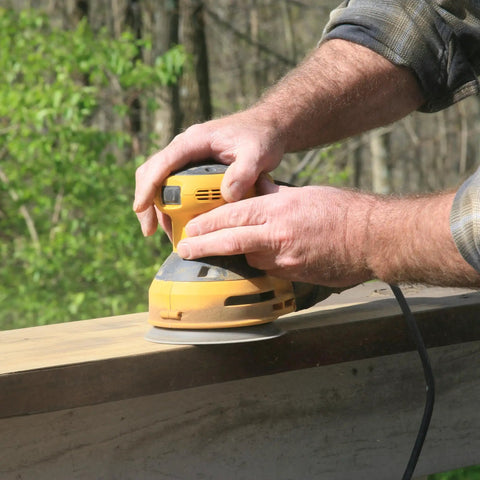Person using electric sander on wood with Gator Auto Hook And Loop Ceramic Sanding Discs With Quick Change System For 180 Grit Blending Paint Removal And Resin Bonded Cutting Power On Tough Surfaces Professional Grade Finishing Sheets You Gotta Have.