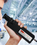 Handheld black fiber-optic inspection microscope with LED illumination, held in hand