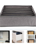 Slick Seven Compartment Folding Fabric Drawer Organizer For Underwear Socks And Hair Accessories To Quick Clean Up Your Bedroom Closet Space Without Any Sweat Or Hassle Today, gray with seven sections.