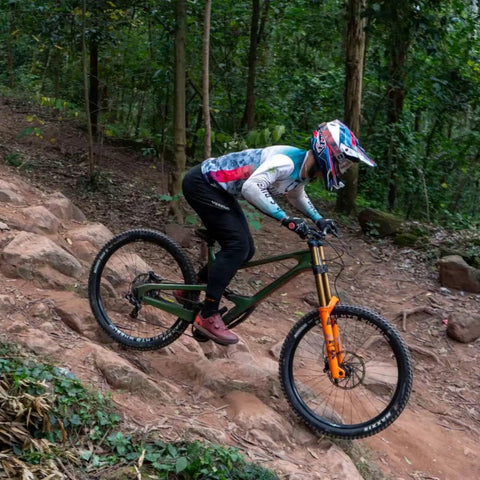 Boy riding downhill wearing Kids Mountain Bike Pants for Boys, Quick Dry, Lightweight, Breathable MTB Pants, Black, Size 12