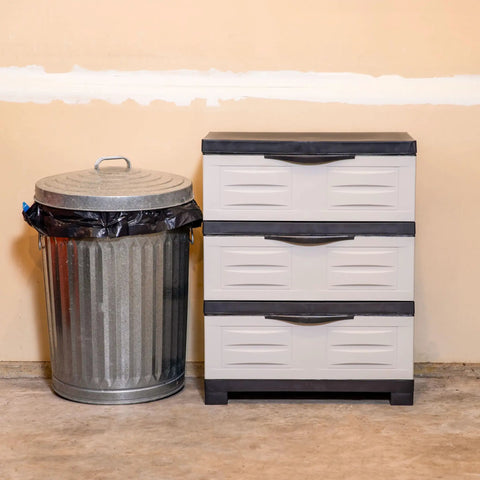 Space Saving 3 Tier Resin Storage Cabinet With Drawers For Garage Office Home And Laundry Room Gray With Charcoal Trim Fully Assembled next to a trash can