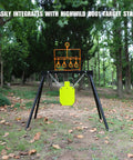 Auto Reset Steel Target For.22 Caliber Rimfire Handguns And Rifles Neon Orange on stand in forest setting
