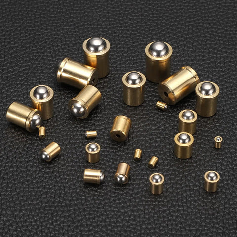 20 Pcs 304 Stainless Steel Ball Plungers Featuring Slick Spring Loaded Push Fit Latch, 3mm Ball Head And Compact 4X6mm Base laid out on a black surface.