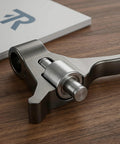 Heavy Duty Hydraulic Pallet Jack Handle Steel Pressure Roller Replacement Featuring Slick Polished Coating For Whisper Quiet Movement And Badass Durability On Warehouse Fleet Trucks close up on polished roller with bearings.