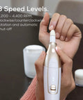 Close-up of the Nail Tech Approved Cordless Electric Drill with adjustable speed controls and LED light for manicures.