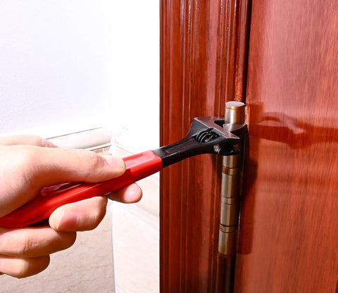 Knuckle Hinge Bender Adjustable Wrench Tool For Residential Door Hinges DIY Friendly Hinge Pliers in use on a door hinge.