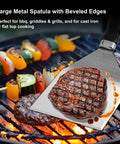 5 In 1 Pro Grade Grill Tools Set With Insulated Meat Resting Blanket heavy duty spatula with steak on grill, vegetables visible