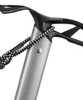 Close-up of Glacier Linkin Ice Axe With Leash 68cm showing grooved shaft and curved head with rope for tech ice climbing.