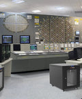 Heavy Duty 12U Soundproof Server Rack Cabinet With 35 Inch Depth And Beast Mode Cooling Fans in a control room setting.
