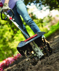Garden Tiller Cultivator Attachment For Gas Powered Multi-Use Outdoor Equipment in action, preparing garden soil.