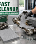 Heavy Duty Oil Absorbent Pads 15 By 20 Inches 50 Pack used for cleaning oily engine parts on a workbench with tools.