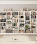 Triple Wide Bookshelf With Six Tier Storage And Seventeen Open Shelves In Pure White displaying books, decor, and plants, ideal for living area.