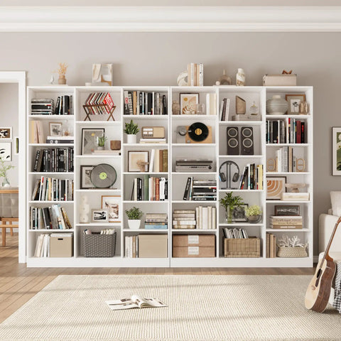 Triple Wide Bookshelf With Six Tier Storage And Seventeen Open Shelves In Pure White displaying books, decor, and plants, ideal for living area.