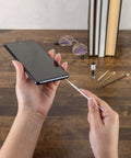 Using Phone Laptop Tablet All In One Cleaning Kit With Precision Spudgers Angled Tweezers DeoxIT D100L on a smartphone
