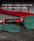 Green Corps Roloc Disc 80 Plus Grit 2-Inch Quick Change Discs Pack Of 25 Heavy Duty shown with grinder on surface