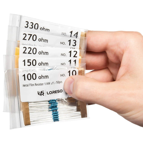 Hand holding components from Massive 1200 Piece Resistor Assortment Kit With 38 Values, 1/4W 1% Metal Film Resistors, ROHS Compliant