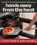 Hans Grill Pizza Peel PRO perforated metal paddle with wooden handle used to launch a pizza into an oven