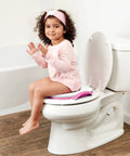 Disney Minnie Mouse Believe In Me Toddler Potty Seat With Super Cozy Cushion on toilet, child sitting comfortably, bright colors.