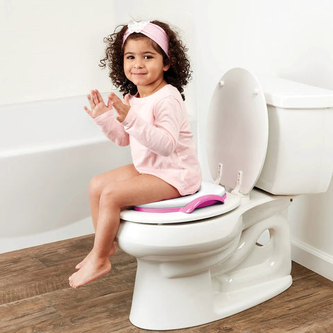 Disney Minnie Mouse Believe In Me Toddler Potty Seat With Super Cozy Cushion on toilet, child sitting comfortably, bright colors.