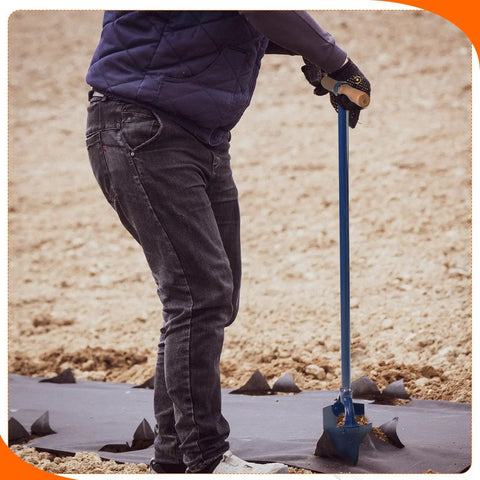 User using Heavy Duty Hand Auger Post Hole Digger 6 Inch By 46 Inch With Non Slip Hardwood T Handle for digging in soil