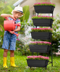 Child watering flowers in a Five Tier Vertical Garden Planter For Balcony Or Patio No Bend Ergonomic Design Space Saving Raised Garden Bed, black.