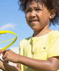 Child playing with Skyrocopter Light Up Flying Disc With Launcher For Kids 5 And Up, Disco Flyer That Shines At Night outdoors