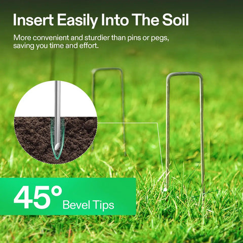 6 Inch Landscape Staples 100 Pack Heavy Duty Workhorse Galvanized Steel Garden Stakes 11 Gauge U Shaped Pins For Weed Barrier Fabric Soaker Hose And Fence Holding Durable Weather Resistant shown inserted into soil with 45-degree bevel tips