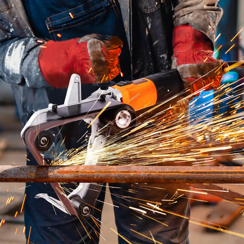 Belt Sander Adapter For Angle Grinder Five Eighths By Eleven Thread Pipe Sanding Attachment with sparks flying during metalworking.