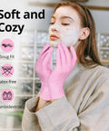 Pink latex-free nitrile ambidextrous gloves, front view of person applying a facial mask.