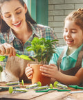 Woman and child using 17 Pack Seed Planter Tool Hand Seeder Mini Sowing Seed Dispenser Sower Seedling Dibber Widger Seed Spreader