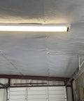 Metal building ceiling with installed 6 Inch Wide White Vapor Barrier Seam Tape 180 Ft Roll Waterproof For Crawl Spaces And Insulation Repairs, Tough Underlayment Seams, Metal Building Insulation Seams Made In USA
