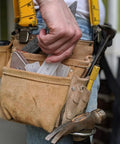 Kick Those Wobbles To The Curb With This Solid Thirty Four Piece Plastic Shim Kit Using Rigid And Flexible Levels For Furniture And Appliances At Home For Any Project, shown in tool belt with various tools.