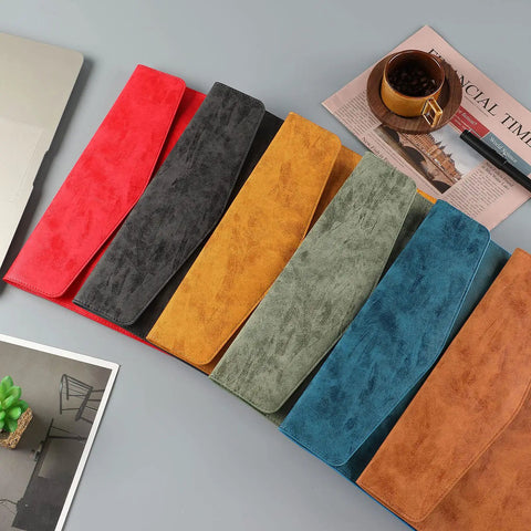 Colorful PU leather A4 file folders on desk, including Army Green version, showcasing waterproof document holder portfolio.
