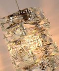 Close-up of Lit Crystal Pendant Light 4 Light Modern Cluster Ceiling Fixture In Chrome With K9 Crystals and Steel Frame