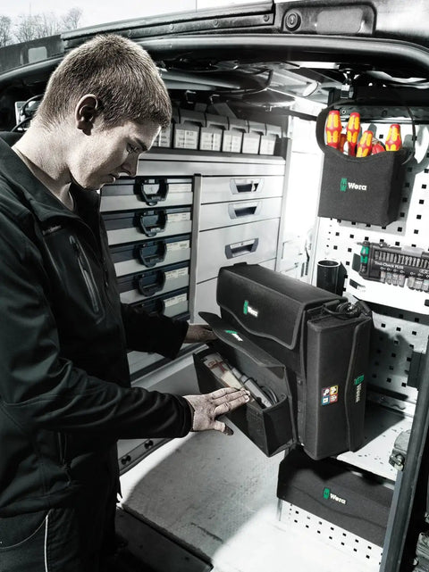 Person using 2Go 2 Tool Container For On The Go Gear Organization in a service van, featuring durable storage and quick access slots.