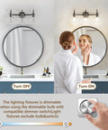 Black Vanity Light 3 Light Modern Bathroom Fixtures Over Mirror With Globe Glass Shade Matte Black Finish E26 Base 17 Inch UL Listed Durable And Super Slick For A Fresh Spa Like Bath shown turned on and off over a round mirror above sink with dimmer switch